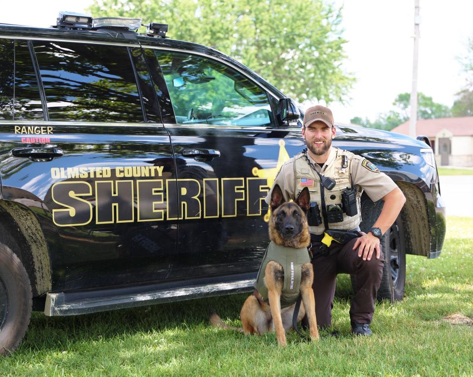 Corporal Heimer and K9 Ranger next to a squad