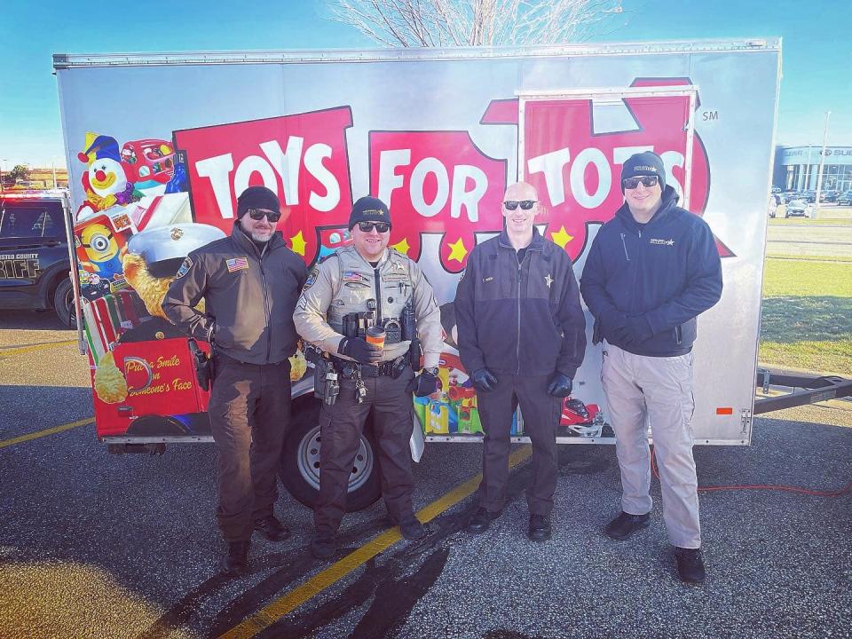 Group photo during Toys for Tots event at Fleet Farm in 2023