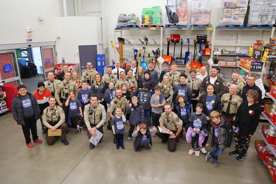 Group photo during Shop with a Cop event at Wal-Mart in 2023