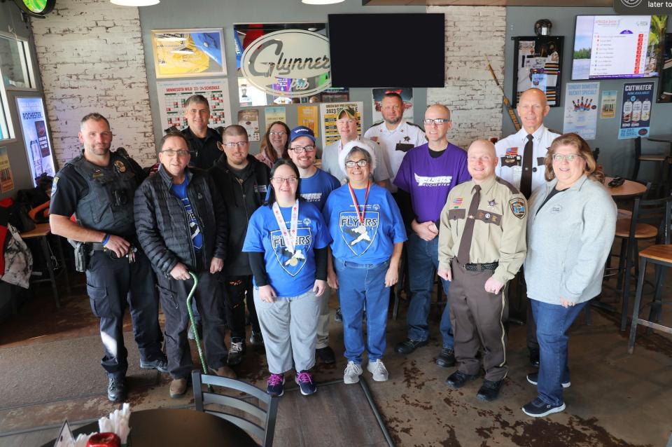 Group photo during Tip a Cop event at Glynner's in 2023