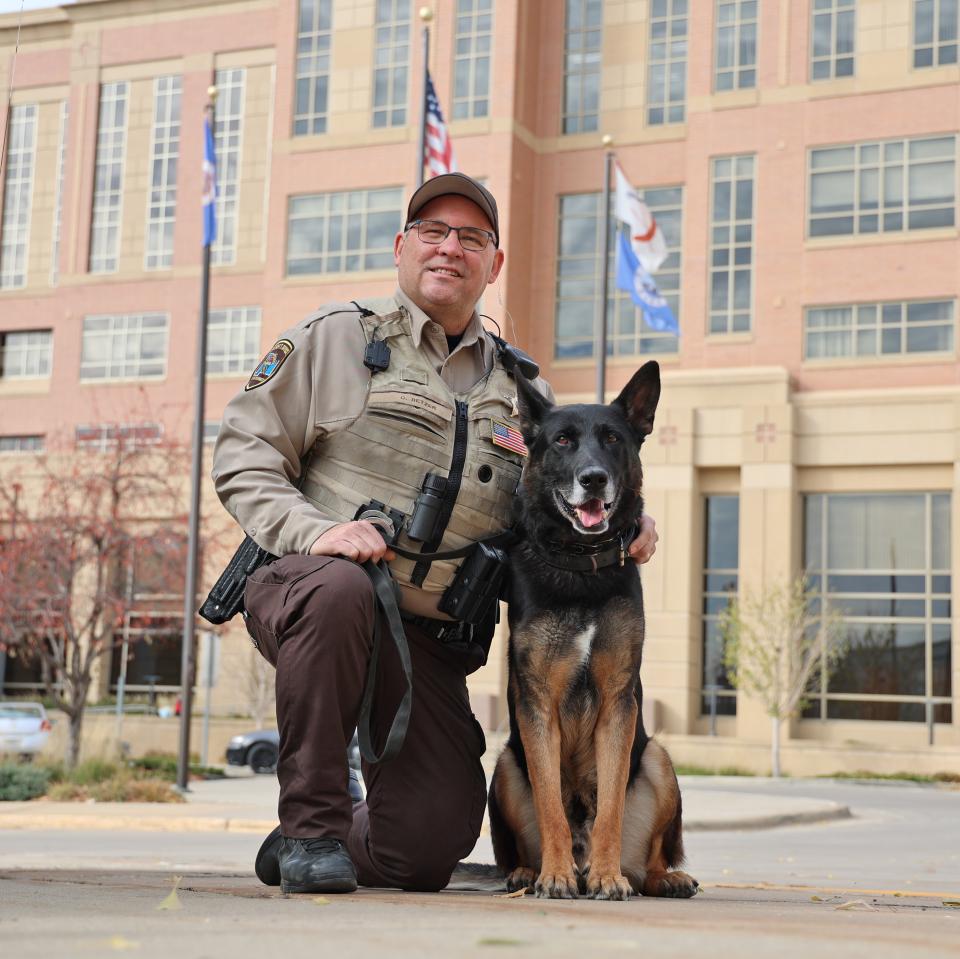 Deputy Corry Retzer and K9 Mikey pose for a photo