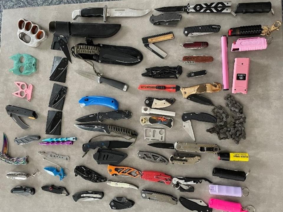 A photo of weapons collected at government center screening in 2023